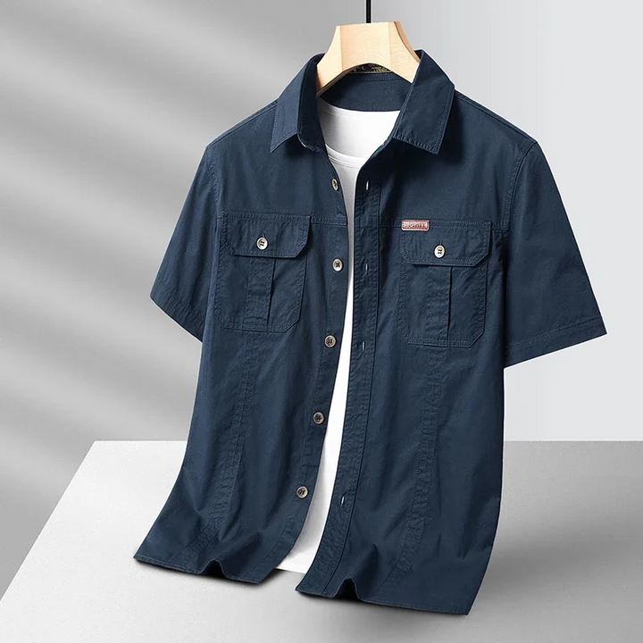 Lightweight men's performance button-up for ultimate comfort. Quick-dry, breathable & moisture-wicking, great for travel.