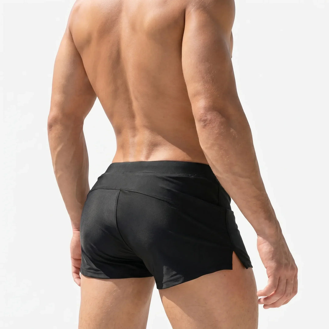 Short-cut men's quick-dry swim trunks, ideal for athletic swimming and comfortable beachwear.