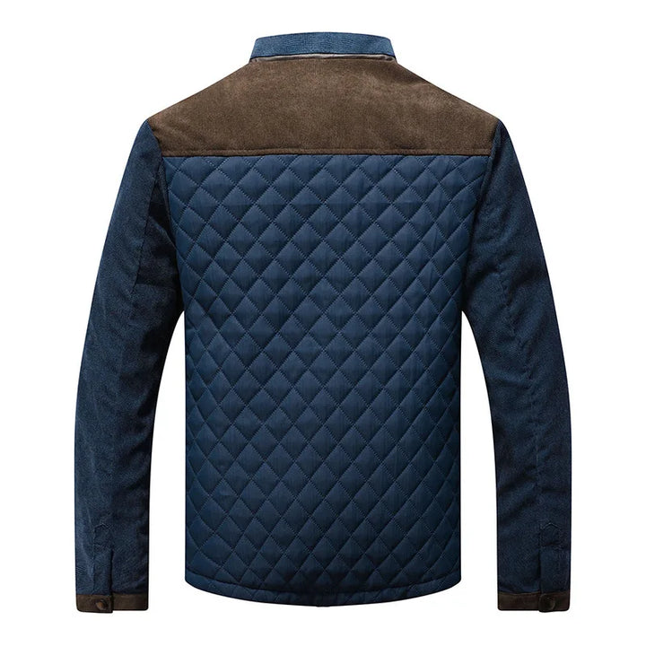 Stylish men's zip-up quilted jacket featuring a stand collar & sharp contrast panels, ideal for fall/winter casual wear.