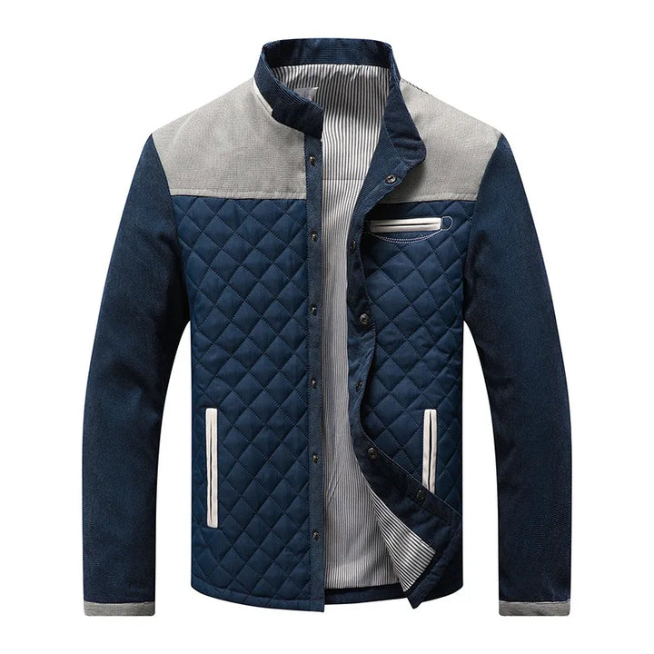Quilted men's outerwear jacket with a stand collar and unique contrast paneling, a fashionable choice for cooler weather.