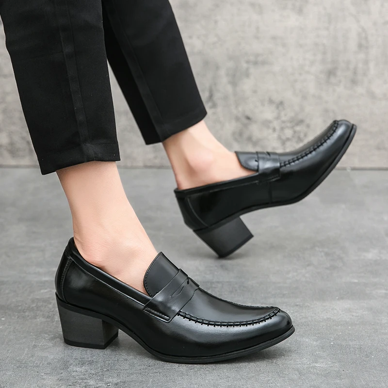 Man wearing Ravello slip-on loafers with suit, demonstrating sleek profile and comfortable fit.