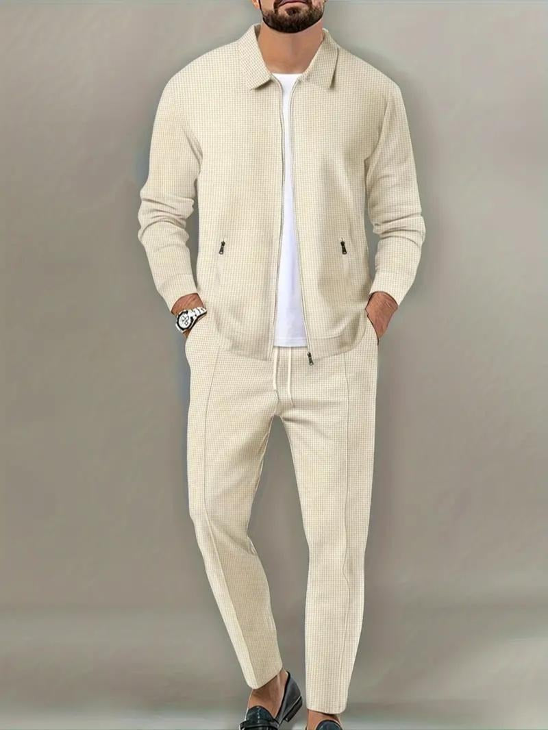 Men's zip jacket & matching joggers. Athletic two-piece tracksuit set for elevated casual wear.