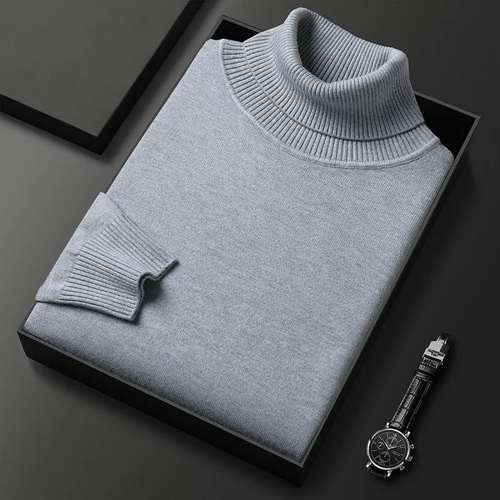 Close-up of men's refined turtleneck sweater, showcasing its soft texture and classic style.