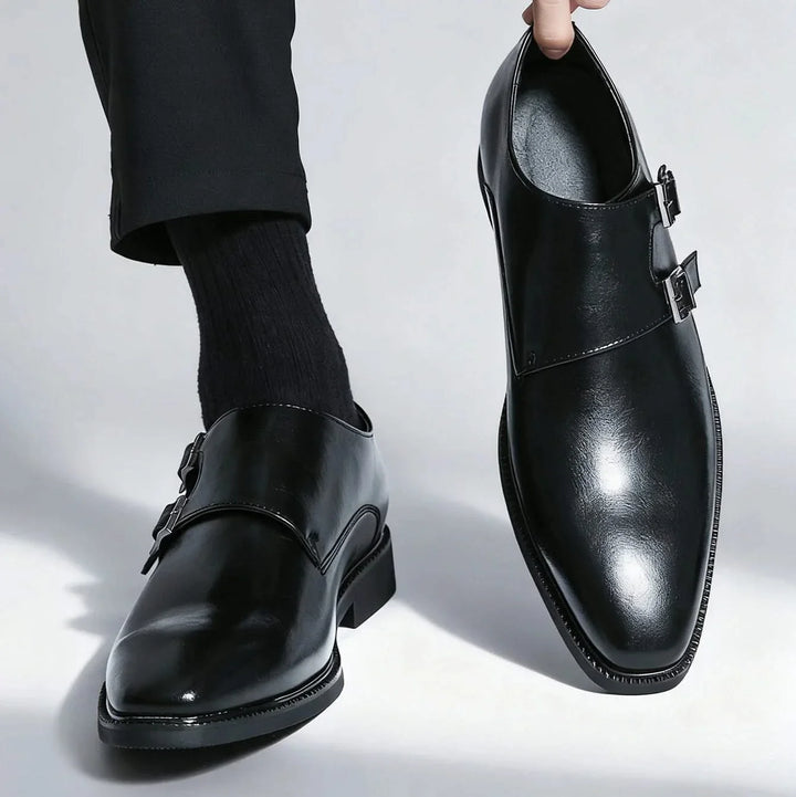 Side profile of men's comfortable Regent Monk Loafers. Black leather, elegant design with a durable sole.