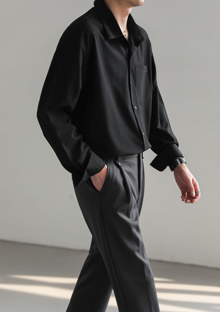Men's relaxed fit button-up shirt styled for casual wear, demonstrating its adaptable and effortless look.