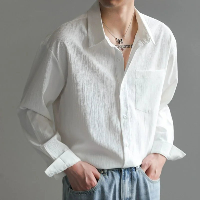 Comfortable blue men's relaxed fit button-up shirt, a versatile choice for men's fashion.