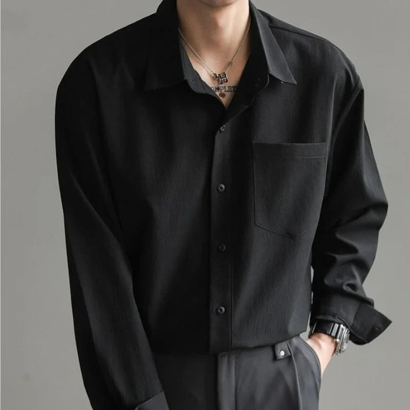 Sleek black men's relaxed fit button-up shirt, offering effortless style & everyday comfort.