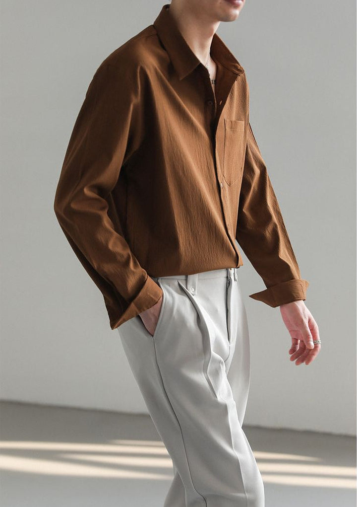 Relaxed fit men's button-up shirt, providing ultimate comfort and a modern, casual look.