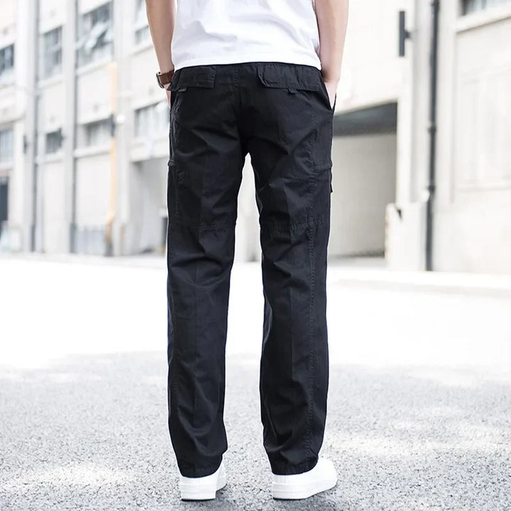 Black men's relaxed fit cargo pants, versatile multi-pocket utility design for casual and modern street style.