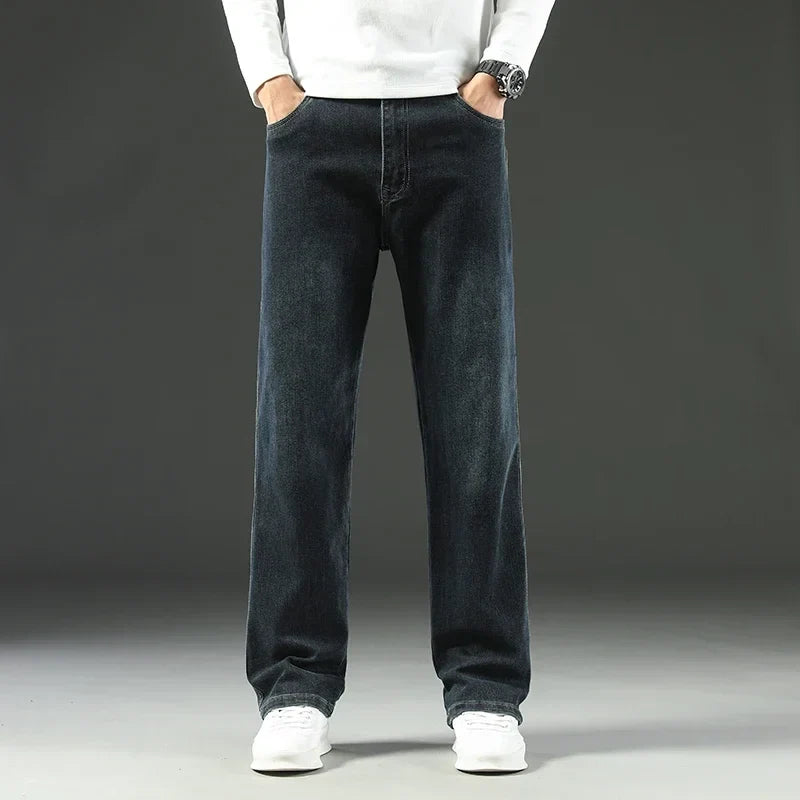 Close-up of durable men's carpenter jeans fabric, showing reinforced seams and practical utility pockets.