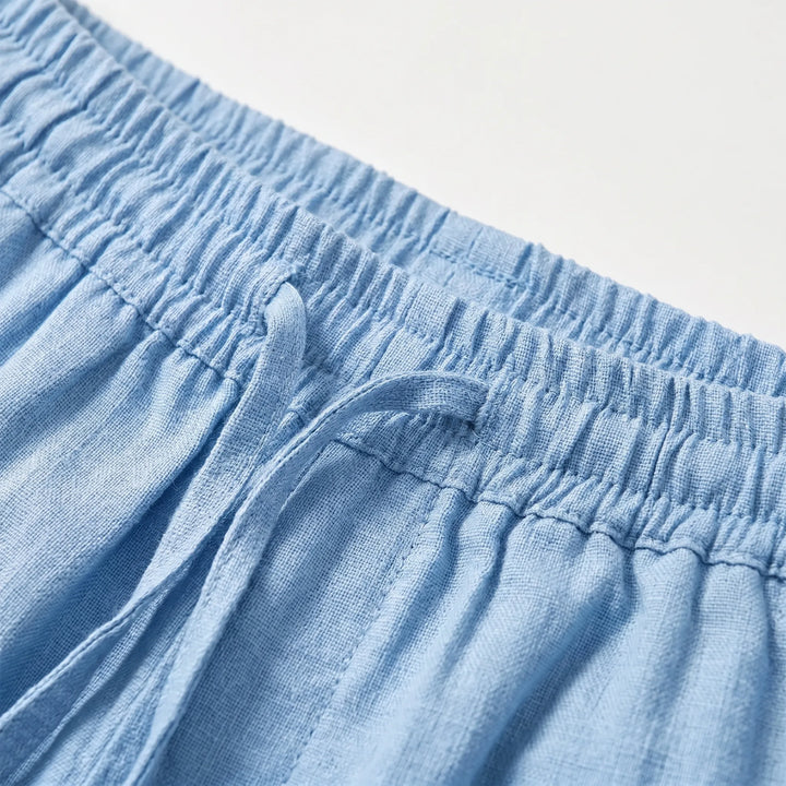 Men's casual straight pants featuring an elastic waist and relaxed fit, perfect for summer travel and everyday style.