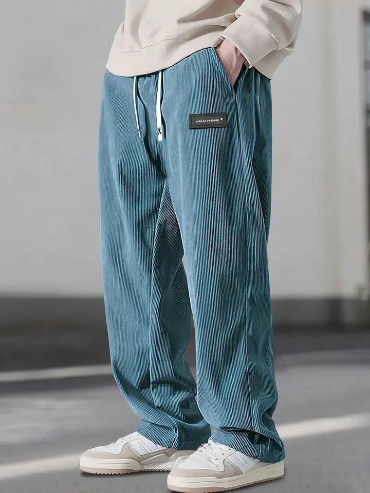 Urban style men's corduroy cargo pants with multiple pockets, full length, perfect for streetwear.