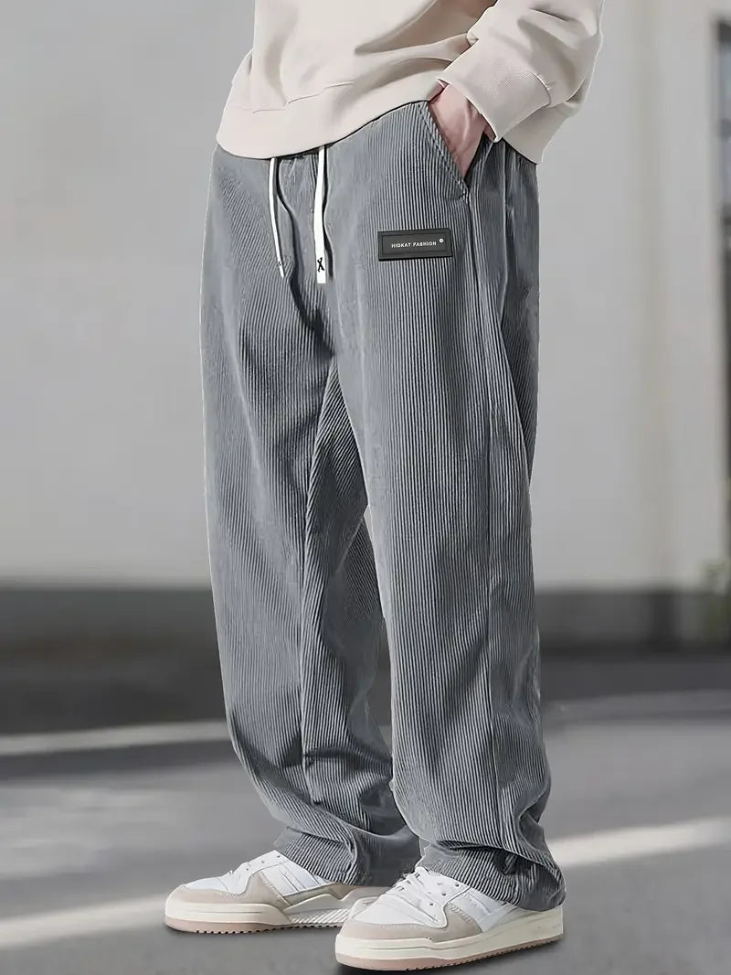 Stylish men's corduroy cargo pants in a relaxed fit. Essential multi-pocket trousers for men's fashion.