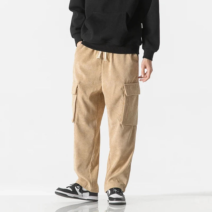 Dark grey drawstring cargo pants for men, featuring a relaxed fit & practical pockets.