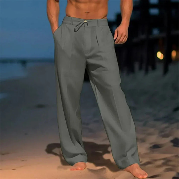 Men's relaxed fit drawstring dress pants, ideal for smart casual or comfortable workwear. Versatile straight leg style.