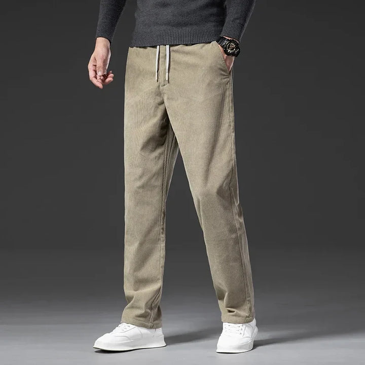 Men's relaxed fit everyday pants in dark grey, featuring a comfortable elastic waist and drawstring.