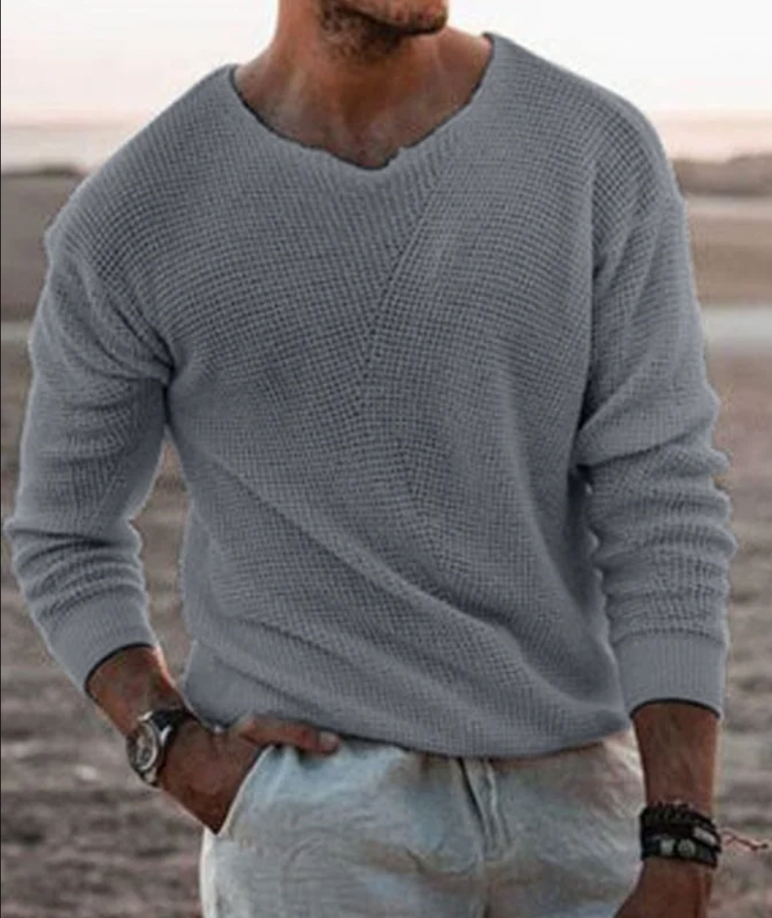 Stylish men's relaxed fit V-neck sweater with long sleeves. Modern casual wear for autumn fashion trends.