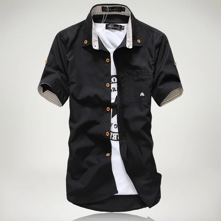 Close-up of a men's relaxed fit short sleeve button-up cotton shirt, highlighting breathable fabric.