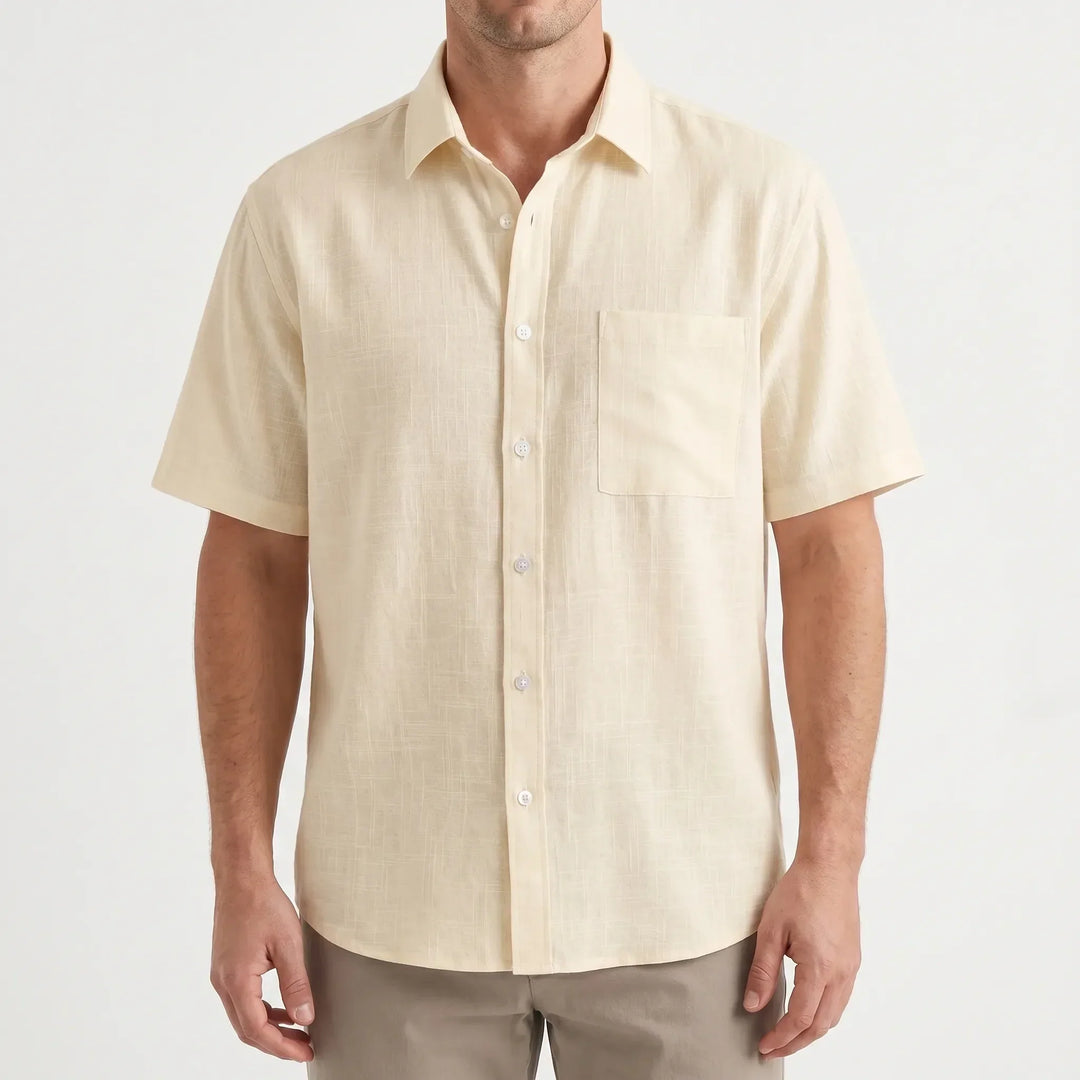 Casual men's short-sleeve button-up shirt in a relaxed fit, ideal for versatile summer and warm weather style.