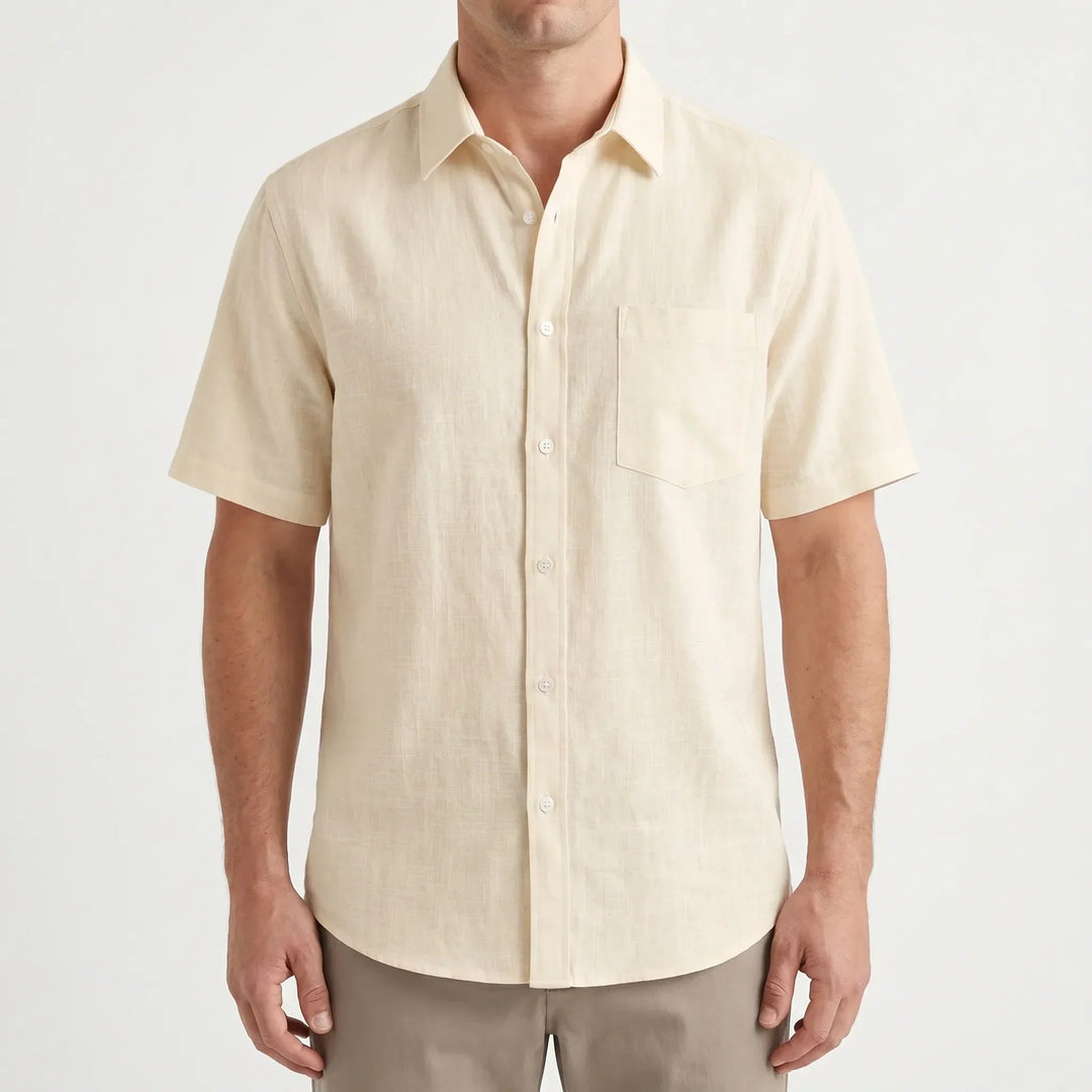 Blue men's short-sleeve casual shirt, relaxed fit, button-up design for comfortable summer and warm weather.