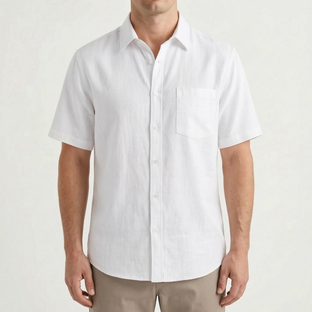 A man wearing a relaxed fit short-sleeve button-up shirt, perfect for casual summer warm weather comfort.
