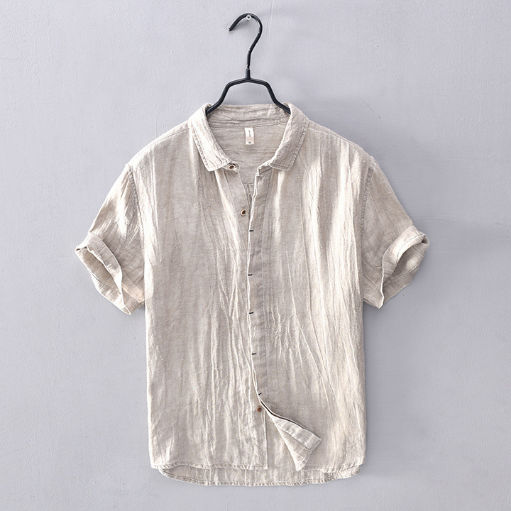 Men's vacation wear short-sleeve button-down, relaxed fit, breathable for summer travel.