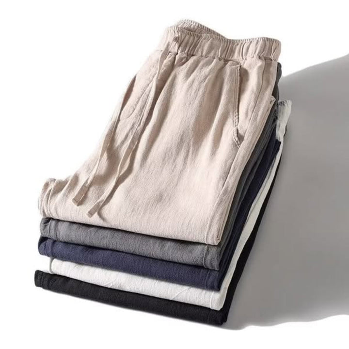 Men's relaxed fit summer casual pants in a light color, perfect for warm weather comfort & daily wear.