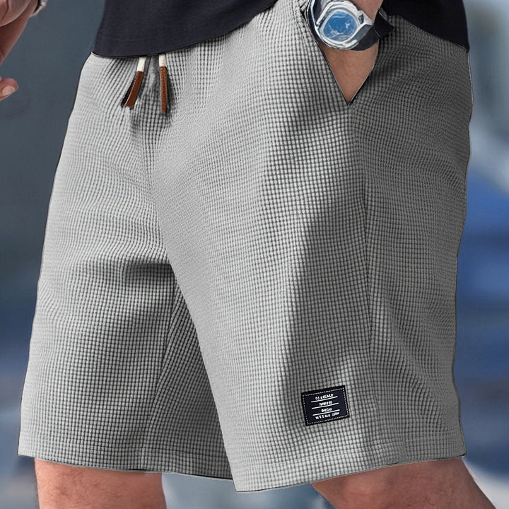Versatile men's relaxed fit waffle knit shorts, great for comfort, leisure, and casual wear.