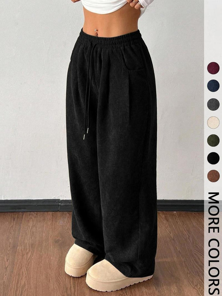 Men's wide-leg trousers with drawstring waist, offering relaxed fit and versatile casual fashion.