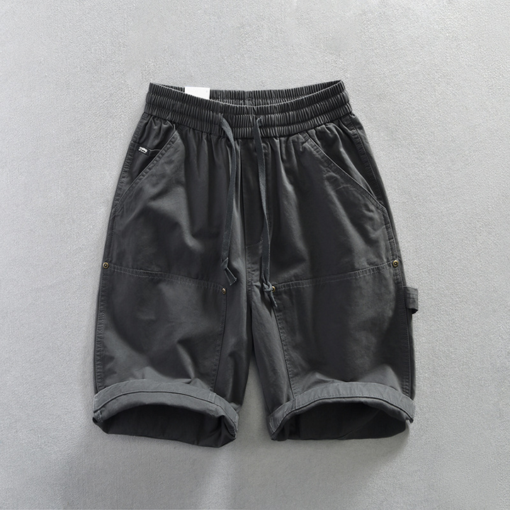 Men's Remo utility shorts, relaxed fit with deep pockets & adjustable waist, suitable for outdoor & active wear.