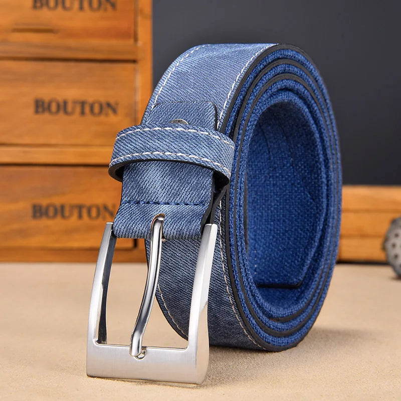 Close-up of the textured denim side of a men's reversible belt, ideal for casual and smart-casual outfits.