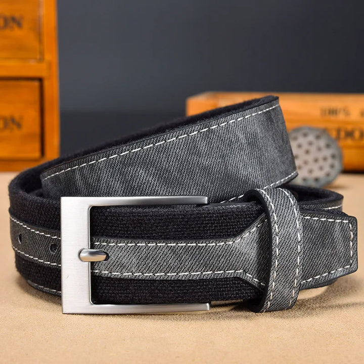 Smooth canvas side of a durable men's reversible belt, offering a sleek look for formal or everyday wear.