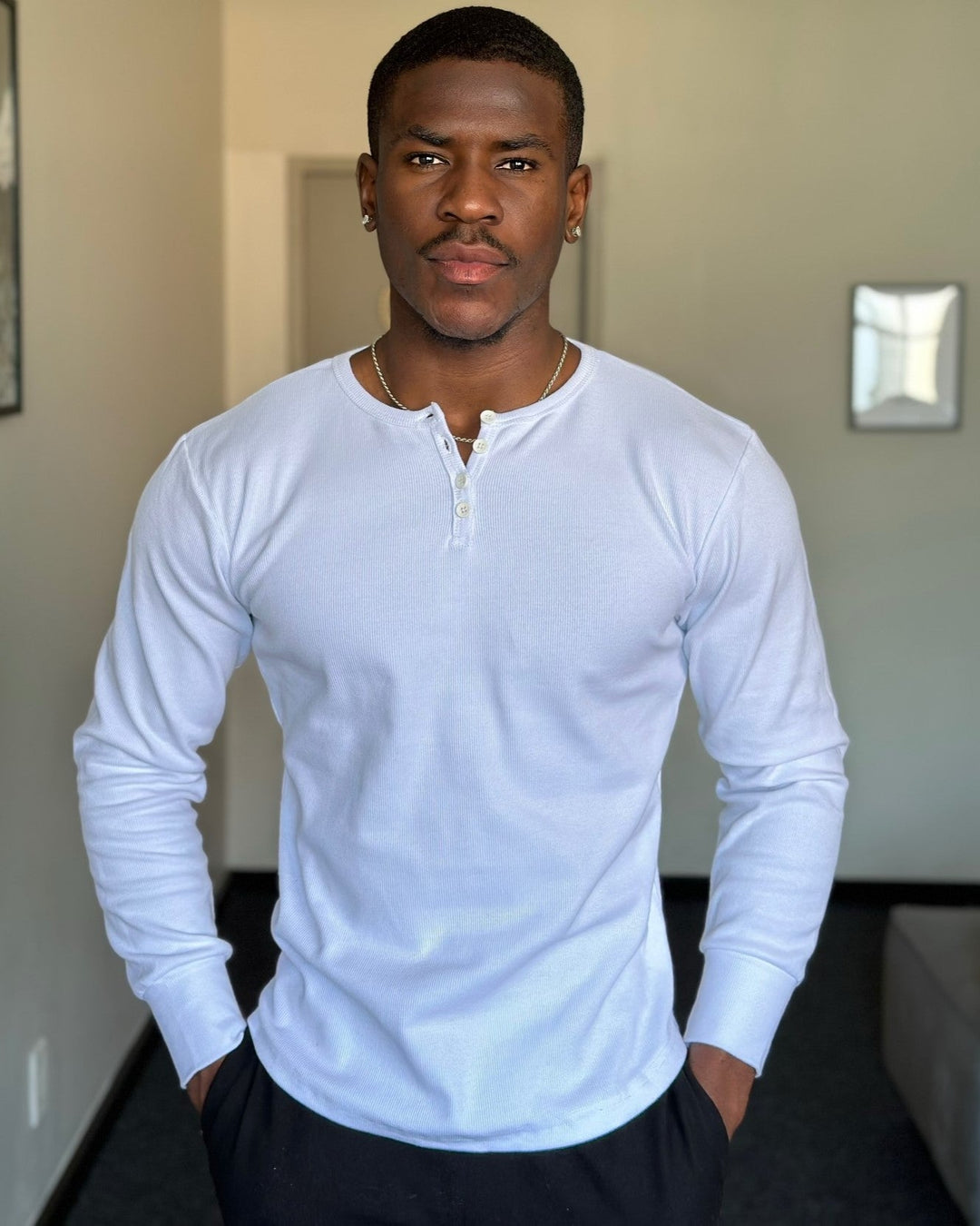 Stylish men's ribbed henley top, a versatile long sleeve basic for layering or everyday fashion.