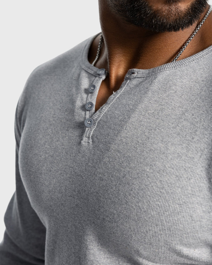 Versatile men's long sleeve henley, ribbed knit texture for warmth and casual layering.