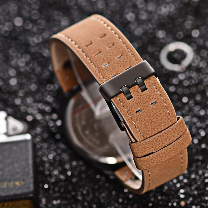 Close-up of a men's rugged cowhide leather watch, showcasing durable stitching, clear dial, and robust casing.
