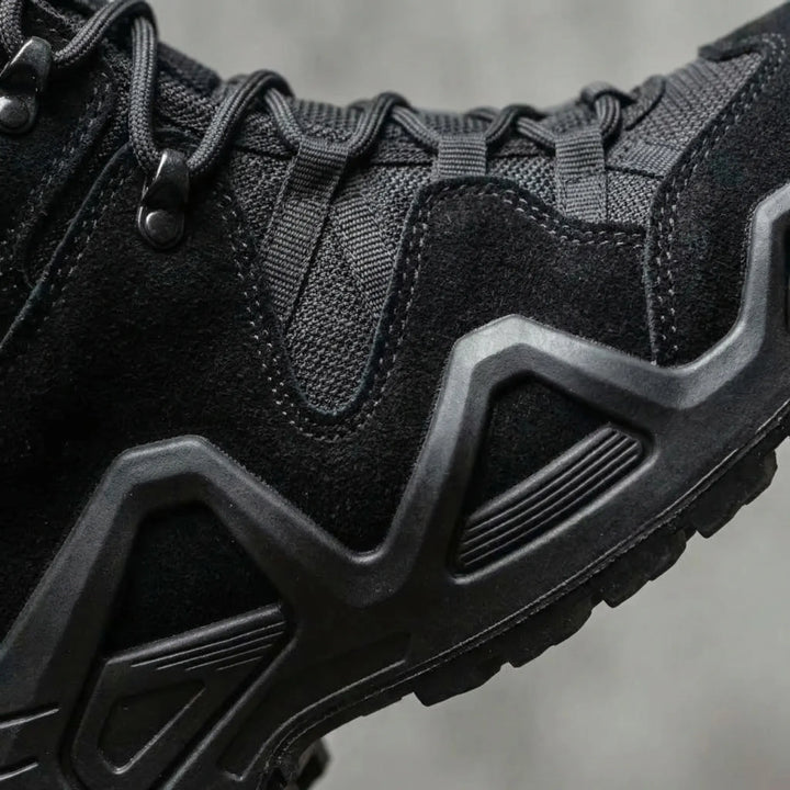 Tactical work boots for men. Rugged mid-top, durable all-terrain outdoor footwear for challenging trails.