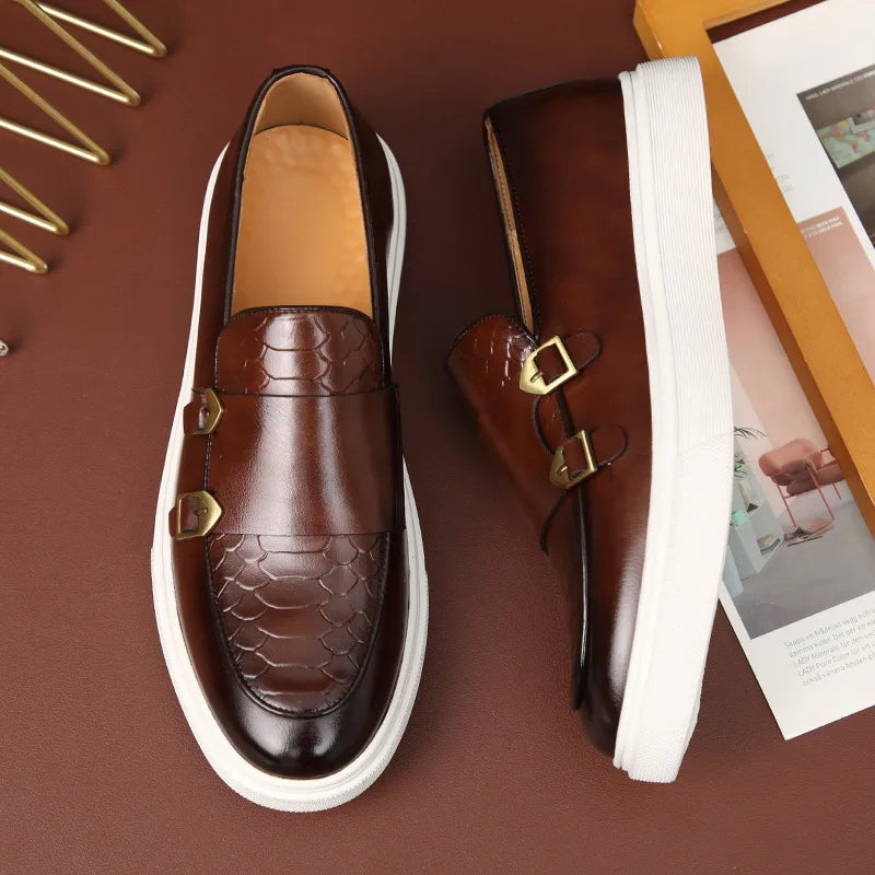 Close-up of men's croc embossed loafers, highlighting unique texture & gold buckle. Versatile modern slip-on shoes.