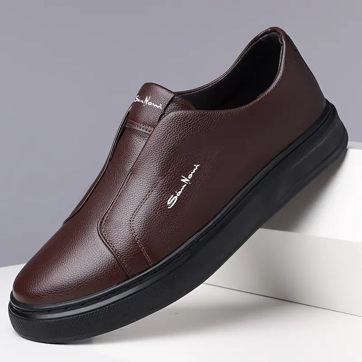 White men's Shoreline slip-on sneakers, offering a clean, classic look with ultimate comfort.