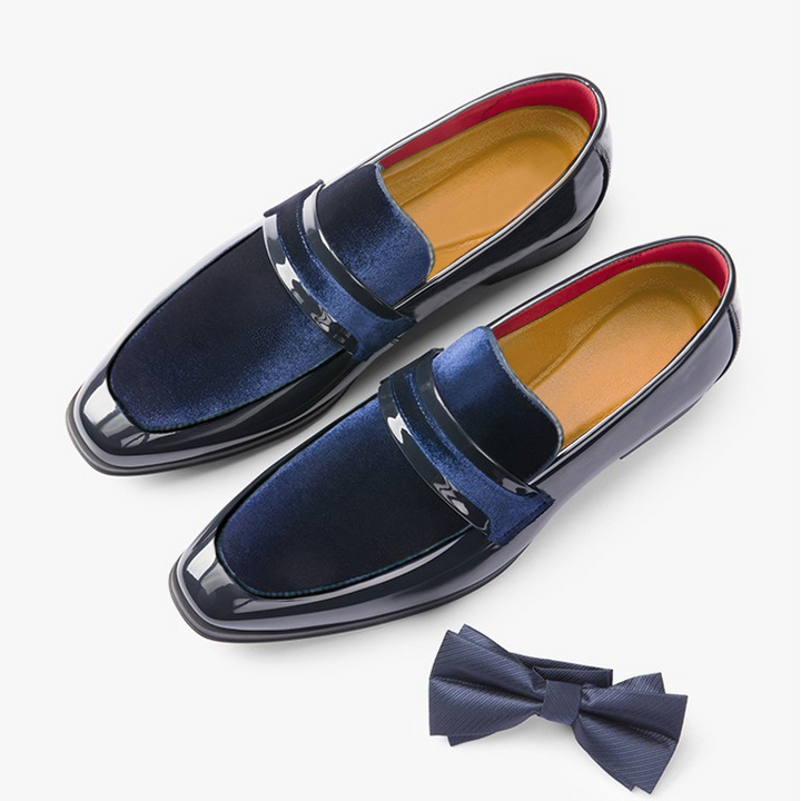 Close-up of elegant men's dress loafers, showcasing sleek design and polished finish for formal wear.