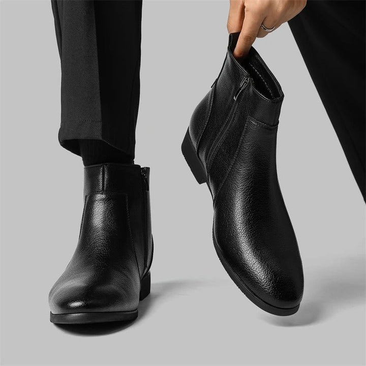 Sharp men's pointed toe ankle boots with a practical side zip for easy wear.