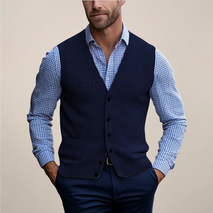 Classic men's sleeveless knit sweater vest, a key layering piece for sophisticated men's fashion style.