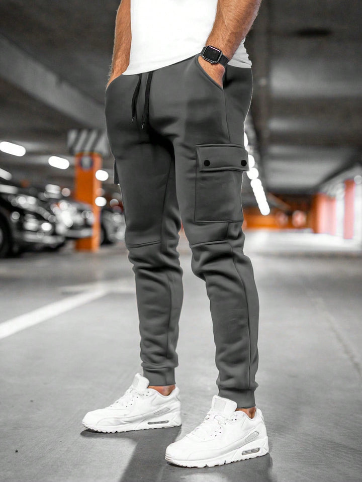 Men's fashion slim-fit pants, streetwear style, modern casual wear.
