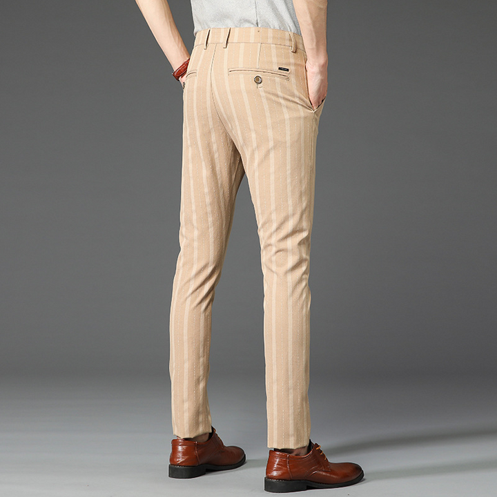 Tailored men's slim fit striped dress pants, offering a sharp look for formal and business wear.