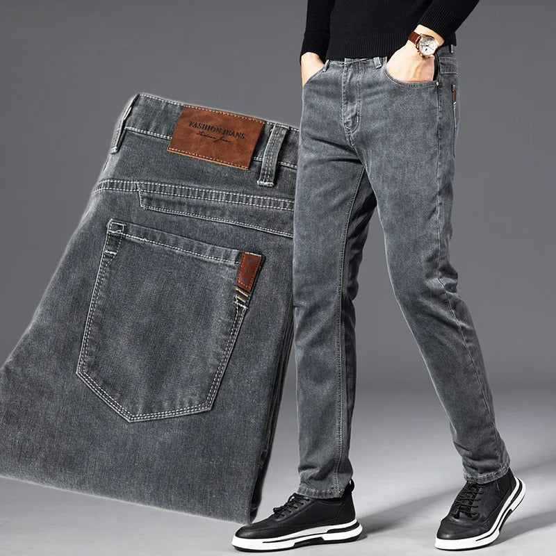 Stylish men's grey slim-fit tapered jeans. Comfortable stretch for everyday casual fashion.