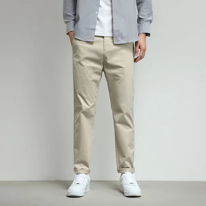 Performance men's slim-fit pants with stretch, perfect for active wear.