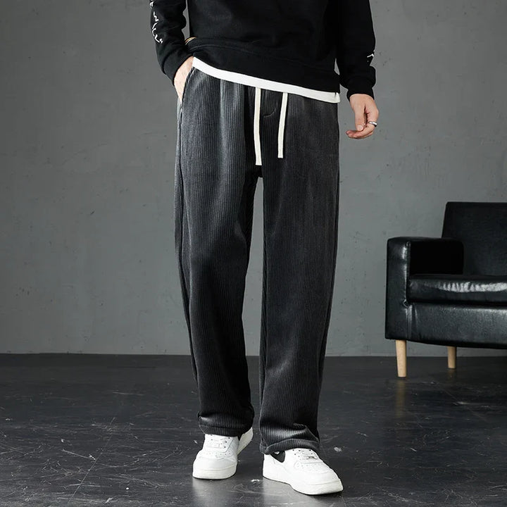Men's casual corduroy joggers with elastic waist and straight leg. Versatile soft pants for everyday comfort.