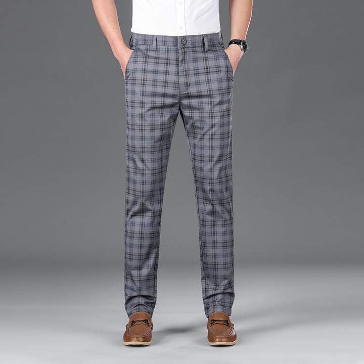 Tailored men's check trousers, offering a sophisticated look in men's fashion.