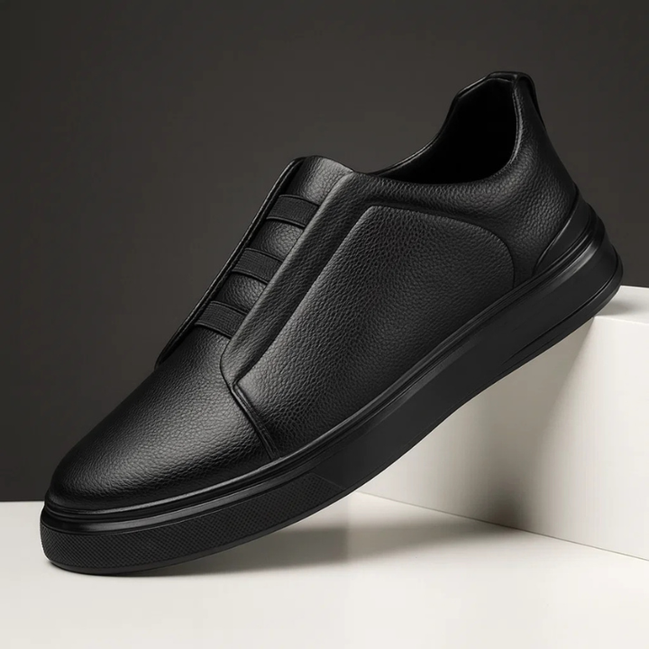 Man wearing comfortable Men's Strada slip-on sneakers. Ideal laceless casual footwear for effortless everyday style.