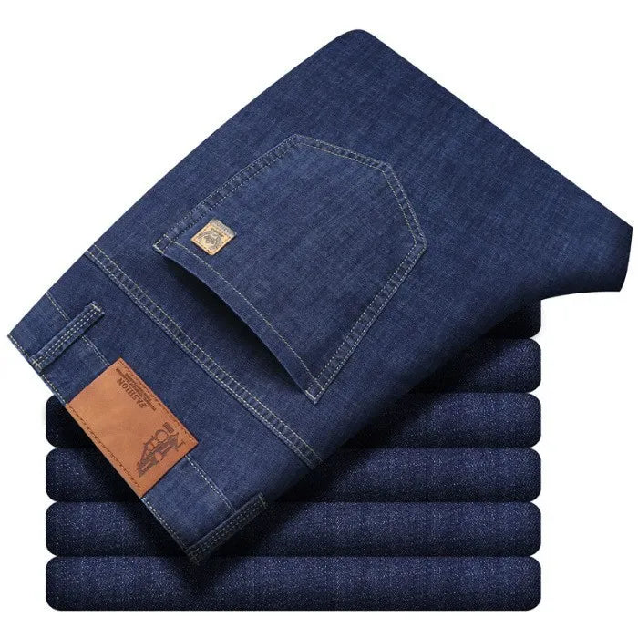 Back pocket detail of comfortable straight fit men's denim jeans in a blue wash.
