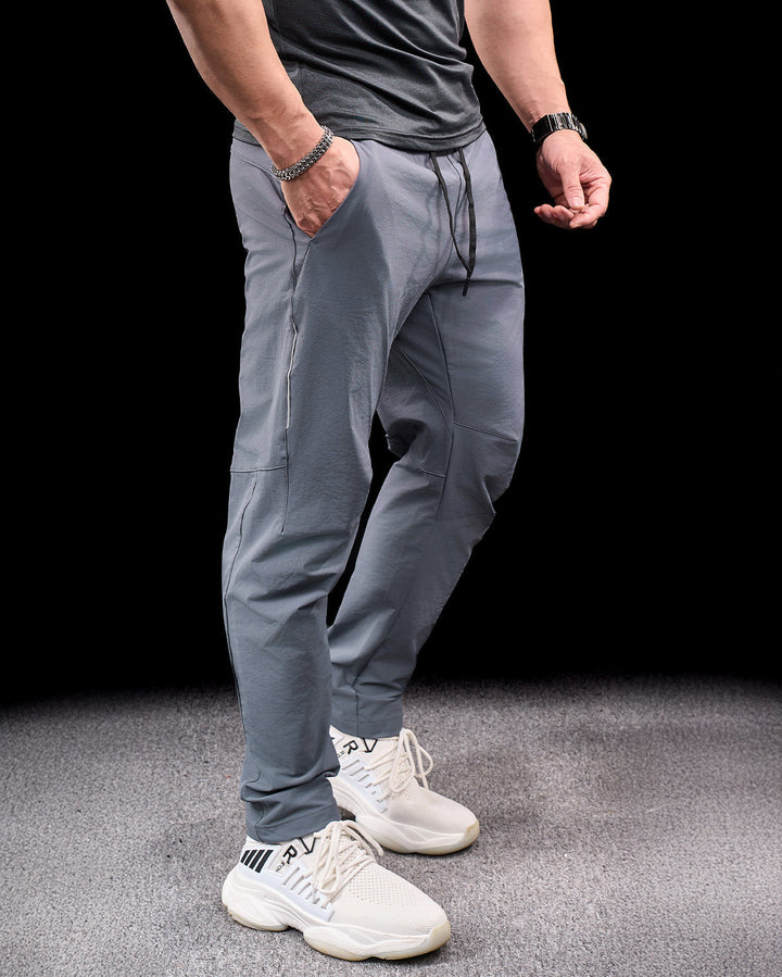 Flexible men's stretch adventure pants, perfect for dynamic outdoor activities & travel.